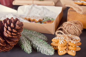 Christmas cookies and gifts box on the wooden table