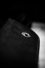 The button on a leather briefcase