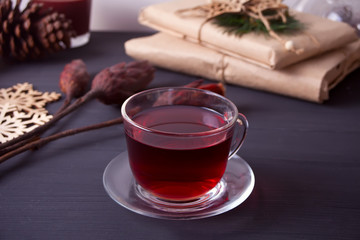 Cup of tea on the black wooden table.