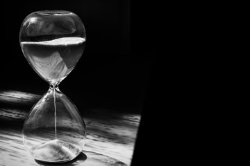 Hourglass on black background