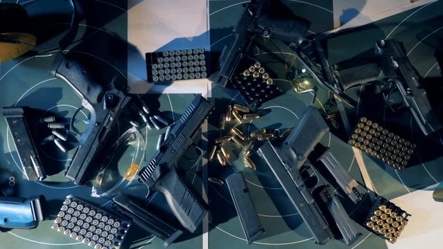 Guns, bullets, ammunition. Equipment for shooting training top view.