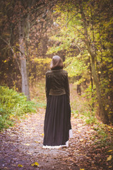Woman walking along the road