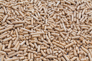 The pellets of compressed hardwood sawdust.