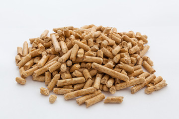 A bunch of pellets of pressed wood sawdust. Isolated.
