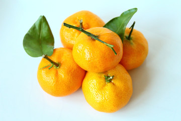 Bright fresh tangerines. Close-up. Isolated object on white background. Isolate.