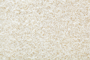 Uncooked white long-grain rice background