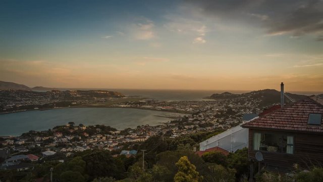Beautiful evening in Wellington, New Zealand. Timelapse video. View towards the airport and the sea.