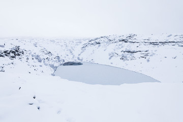 Kerid volcano crater during winter snow in Iceland
