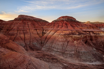 Rainbow Mountains in China. Rainbow City, Wucai Cheng. Colorful layered landforms in a remote desert area of Fuyun County. Uygur Autonomous Region, Xinjiang Province. Early Morning Vibrant Sunrise