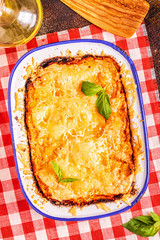 Traditional italian lasagna with vegetables, minced meat and cheese.