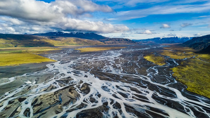Panoramic drone view of the large riverbed next to the famous Seljalandsfoss waterfall