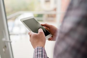 man using digital tablet