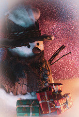 Festive scene: snowman with gifts
