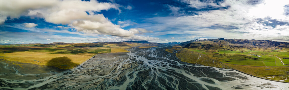 Panoramic drone view of the large riverbed next to the famous Seljalandsfoss waterfall