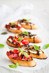 Sun dried tomatoes, cream cheese and fried mushrooms bruschetta - obrazy, fototapety, plakaty