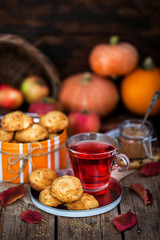 Fresh homemade delicious apple cookies and cup of hot red tea
