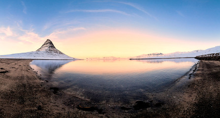 Fototapeta na wymiar Kirkjufell view during winter snow which is a high mountain on the north coast of Iceland's Snaefellsnes peninsula, near the town of Grundarfjordur 