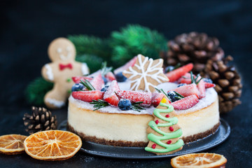 Delicious Christmas ginger cheesecake with fresh berries decoration