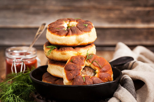 Traditional Russian deep fried meat patties (belyash)