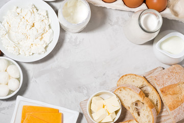 assortment of fresh farm dairy products on white background, top view