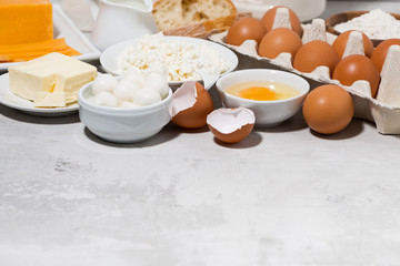 assortment of fresh farm dairy products on white background