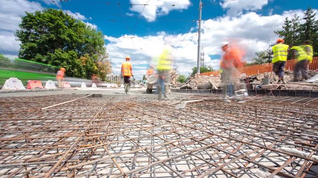 Concrete works for road construction with many workers and mixer timelapse hyperlapse
