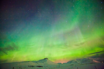 Aurora Borealis or better known as The Northern Lights for background view in Iceland, Snaefellsnesvegur during winter