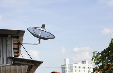 Satellite antenna on roof of Poor house in slum