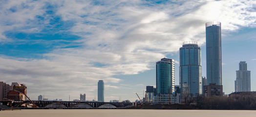 Panorama of Yekaterinburg, Russia, skyscrapers, bridge over the pond of the river Iset.