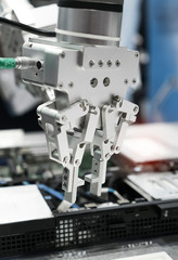Robotic arm installing a computer chip with cpu