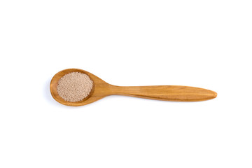 top view of a spoon of sandal wood with yeast isolated on white background
