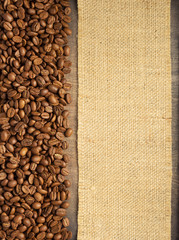 Fototapeta premium coffee beans on wooden table