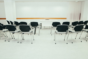 Fototapeta na wymiar Business meeting Seminar room empty Seats with Blank Mock up white board