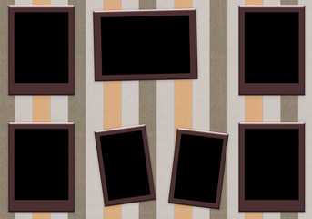 blank photo frames on wooden background