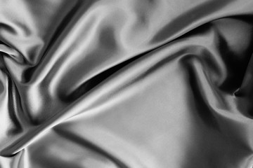 silk satin texture background silber color.Abstract background of luxury cloth wave.