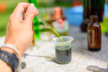 Green water in test tube in lab