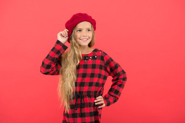 How to wear beret like fashion girl. Kid little cute girl with long hair posing in hat red background. Fashionable beret accessory for female. How to wear french beret. Beret style inspiration