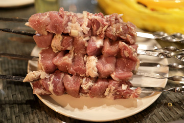 Raw meat on skewers