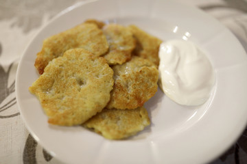 Potato pancakes with sour cream