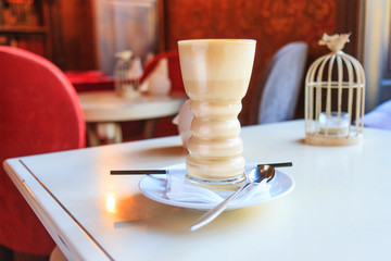 latte in a beautiful glass in an expensive interior