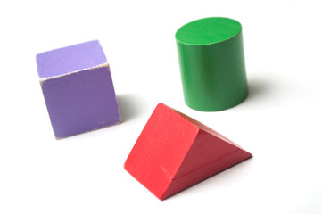 closeup of colorful wooden blocks game on white background