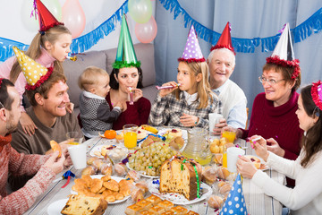 family having fun during children’s birthday party
