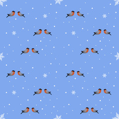 Seamless bullfinch and snowflakes on a blue background