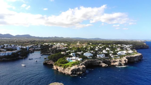 Flight over the bay of Cala D'or and Cala Ferrera in Mallorca