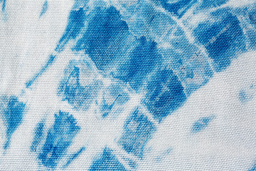 The fabric indigo tie dye as a background and texture.