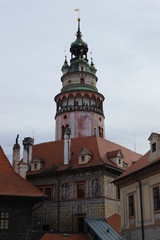 Fototapeta na wymiar Cesky Krumlov castle tower view from the street of old town