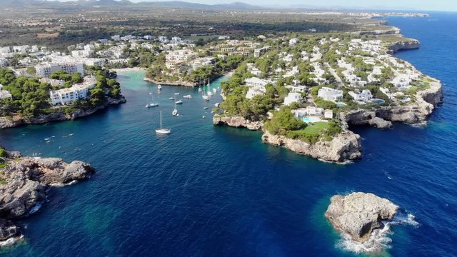 Flight over the bay of Cala D'or and Cala Ferrera in Mallorca