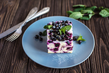 Delicious homemade cottage cheese casserole with berries on a plate