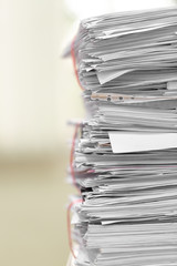 Document pile on office desk, Stack of business paper on the table with blurred of meeting room