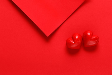 red paper sheets with two red hearts